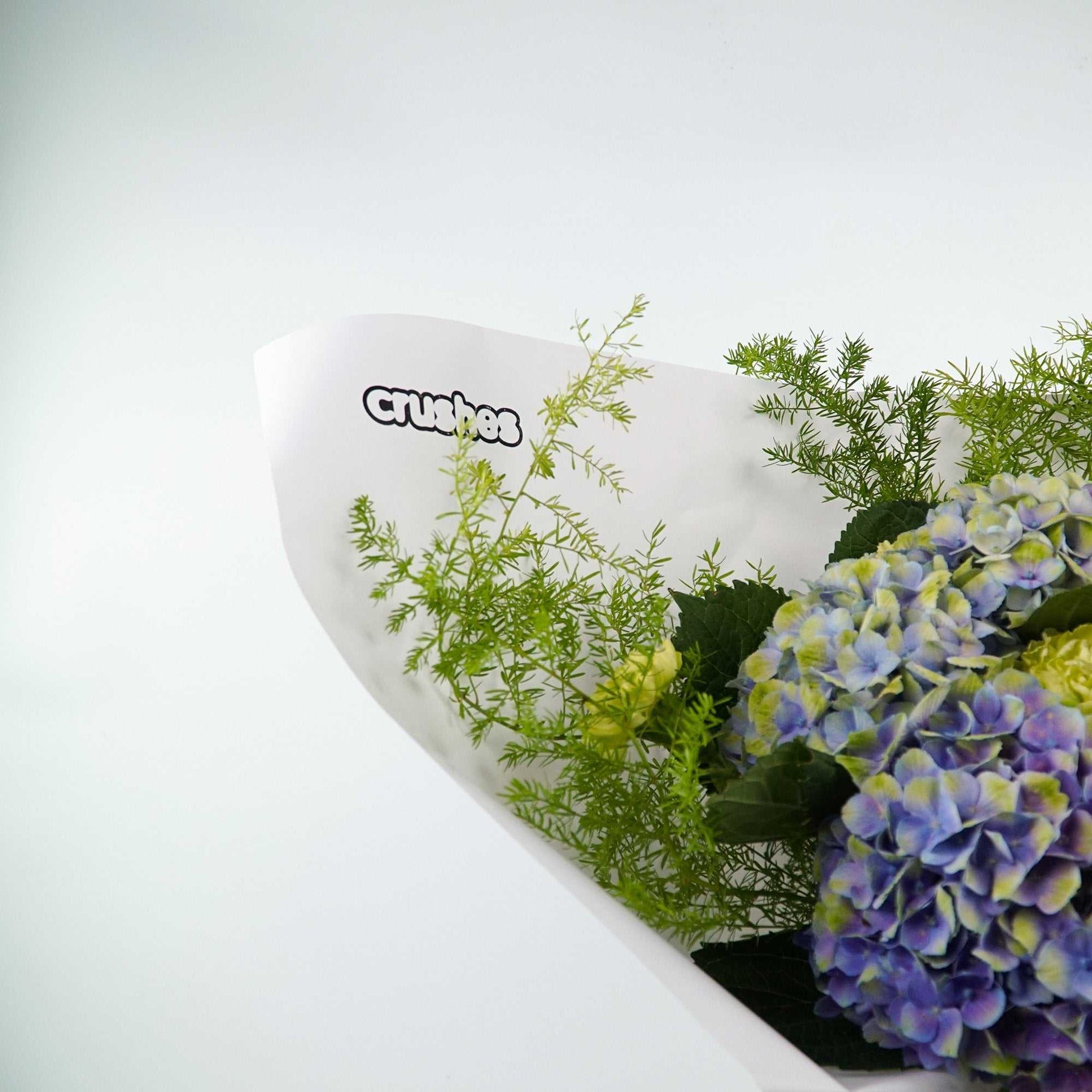 The No.02 - Monochrome Bouquet floral arrangement with green blooms, foliage, antheriums, and hydrangea.