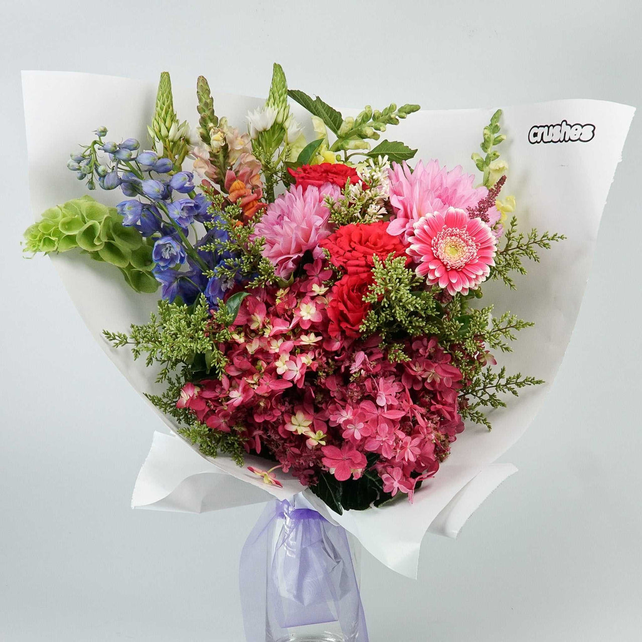 Extra large bouquet of seasonal flowers with gerberas, roses, dahlias, snapdragons, and more foliage. Extra Large Crush from crushes flowers