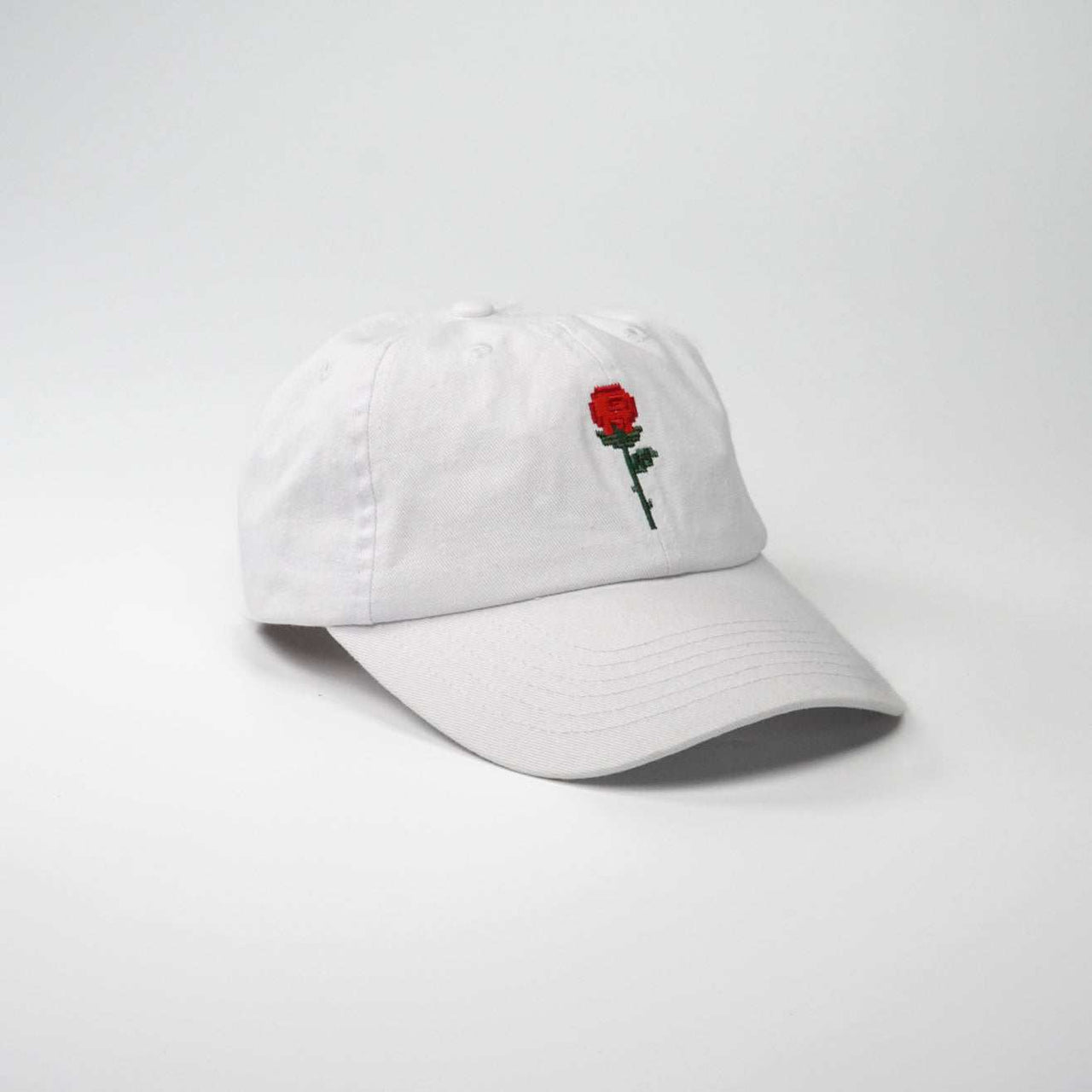 Crushes Pixel Rose White Cotton Cap with red rose embroidery, adjustable fit, 100% cotton.