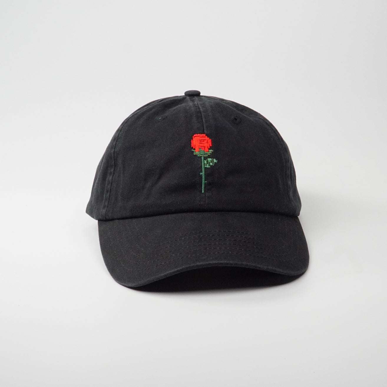 Crushes Pixel Rose Black Cotton Cap with embroidered red rose design, adjustable size.