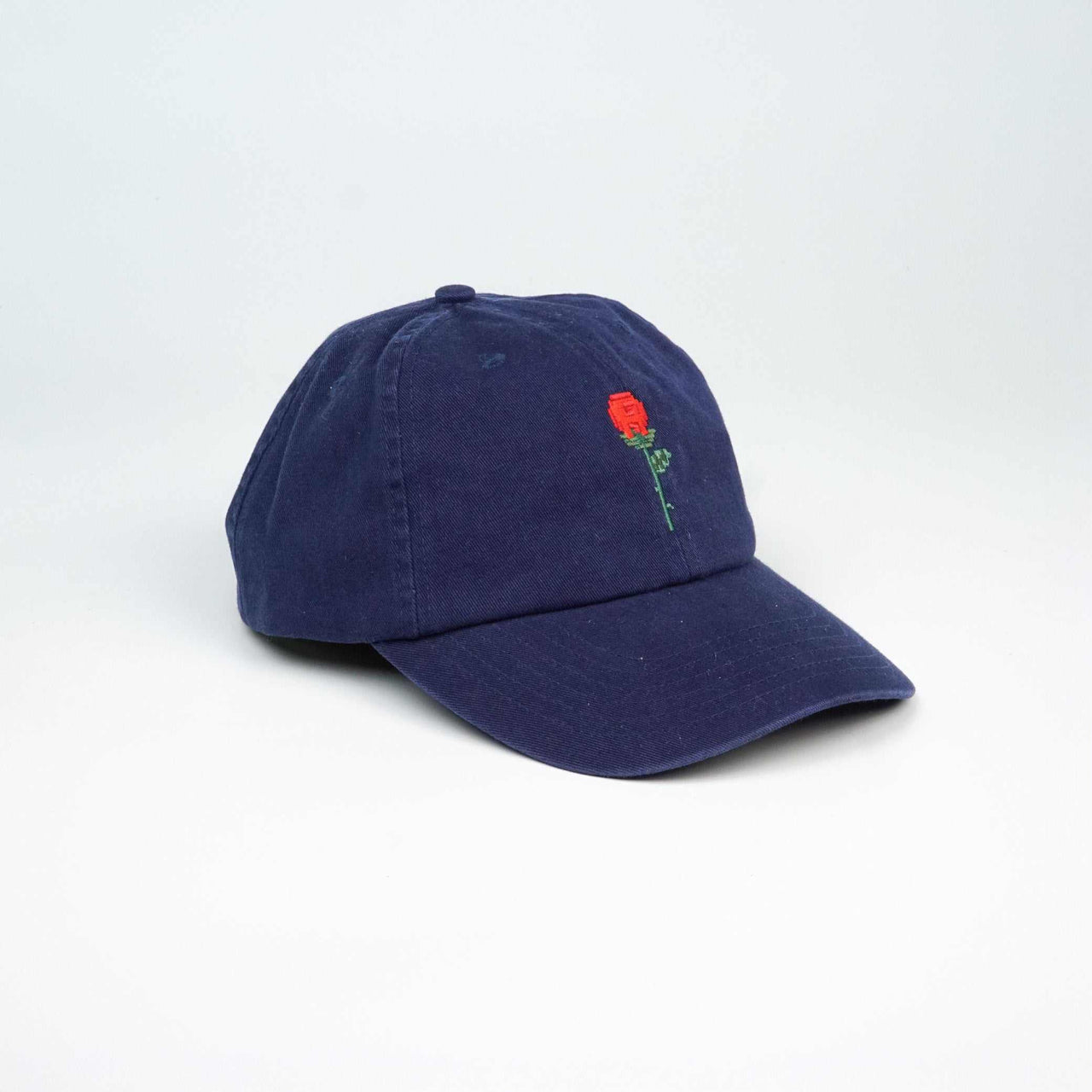 Navy Crushes Pixel Rose cap with embroidered rose design, adjustable fit.