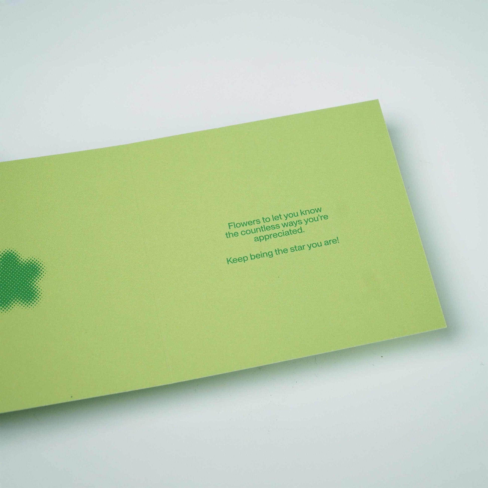 Green greeting card with a message expressing appreciation and encouragement.