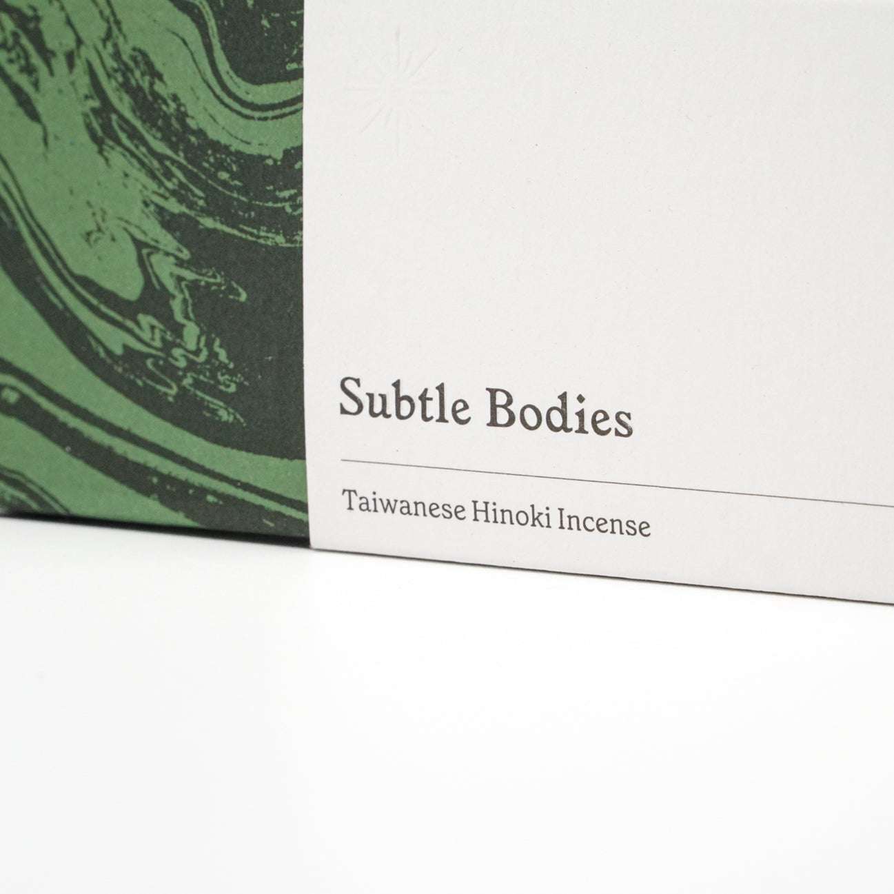 Packaging for Thai Hinoki Incense by Subtle Bodies, featuring Taiwanese Hinoki wood scent.