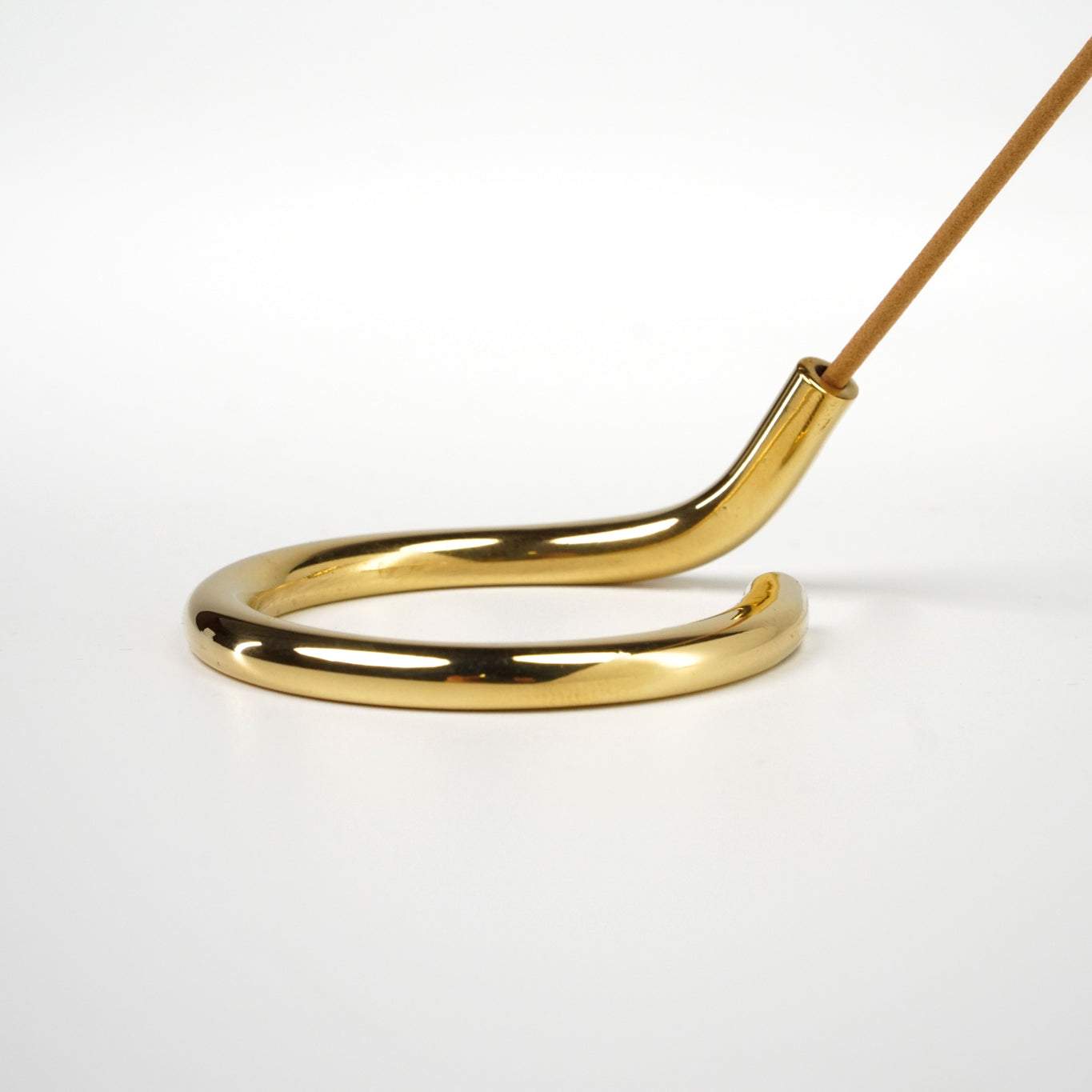 Brass circular incense holder handcrafted in Northern India.