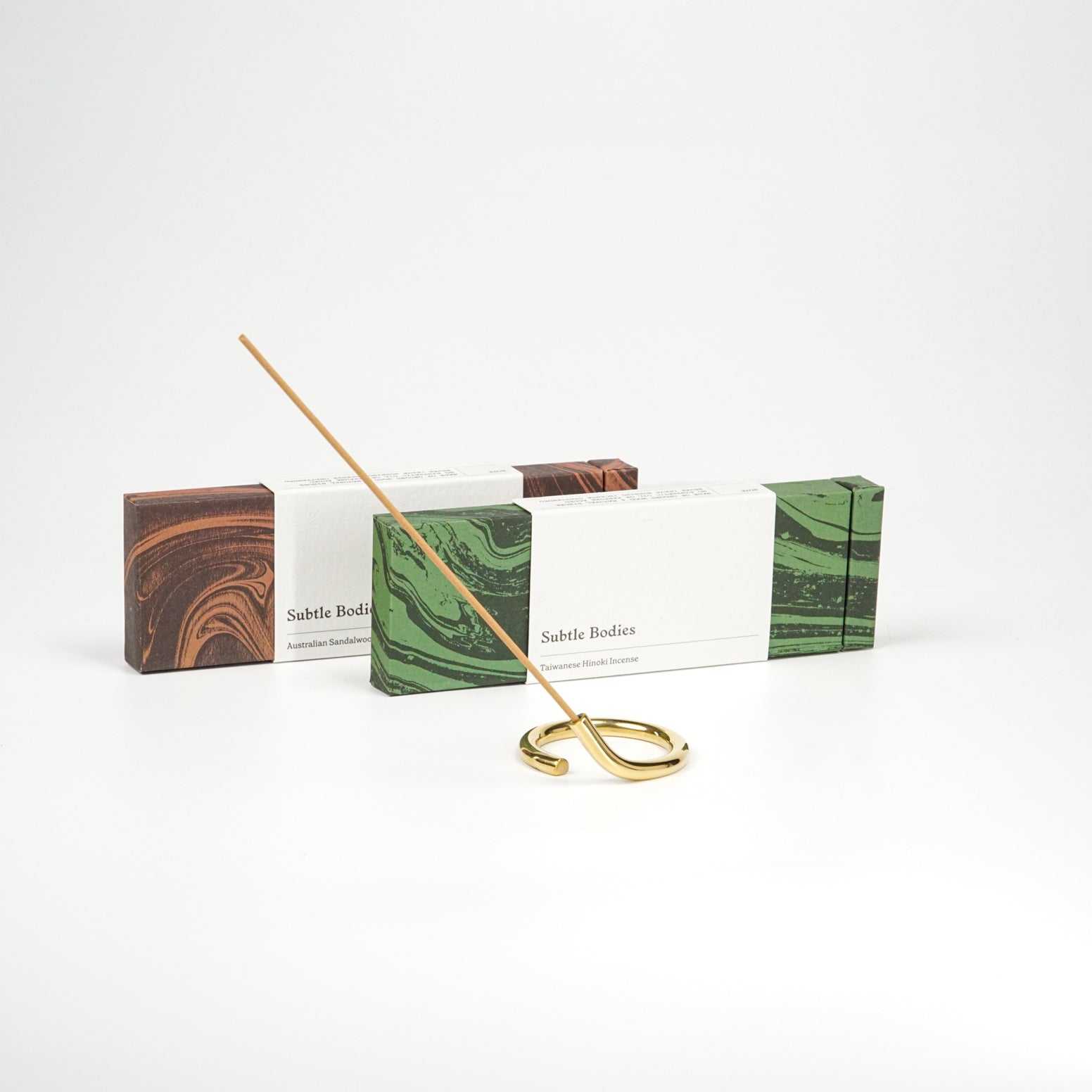 Handcrafted solid brass incense holder from Subtle Bodies with a unique circular design.