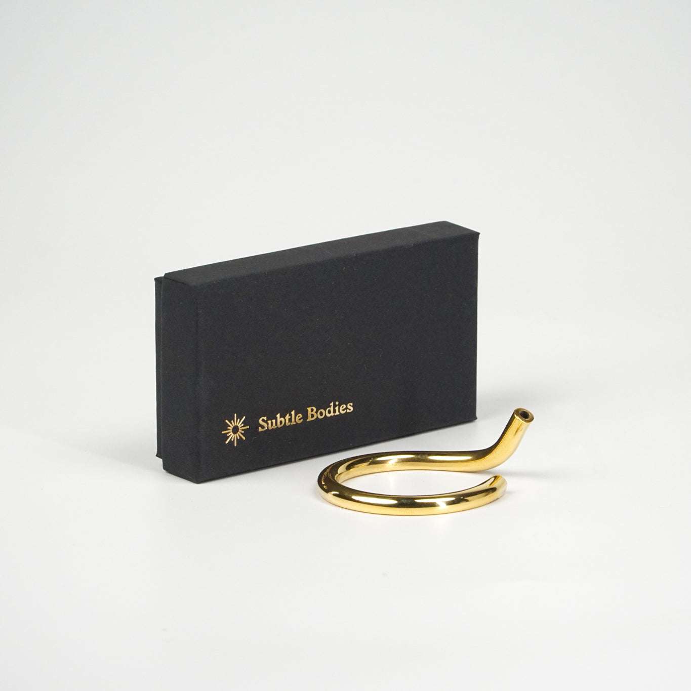 Handcrafted brass incense holder in circular design with gift box.