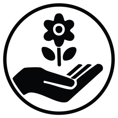 Black icon of a hand holding a flower within a circular border on a white background