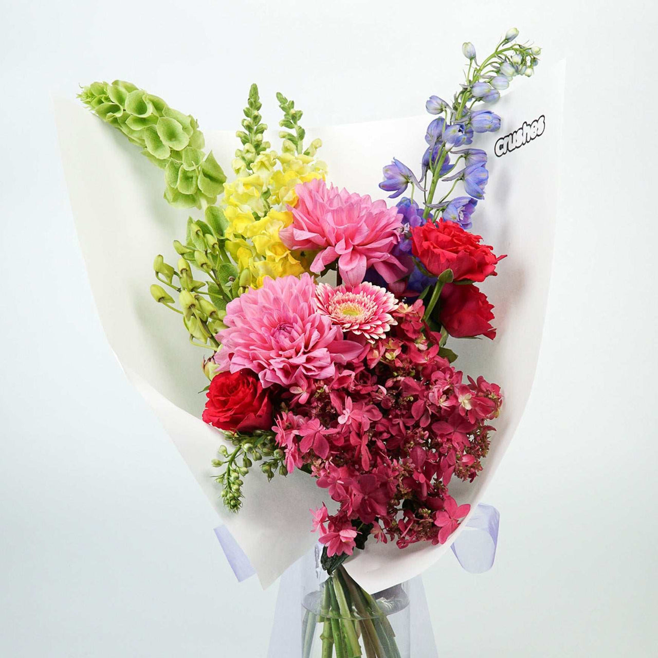 The No.04 Colour Crush vibrant flower bouquet with delphinium, roses, dahlias, and more.