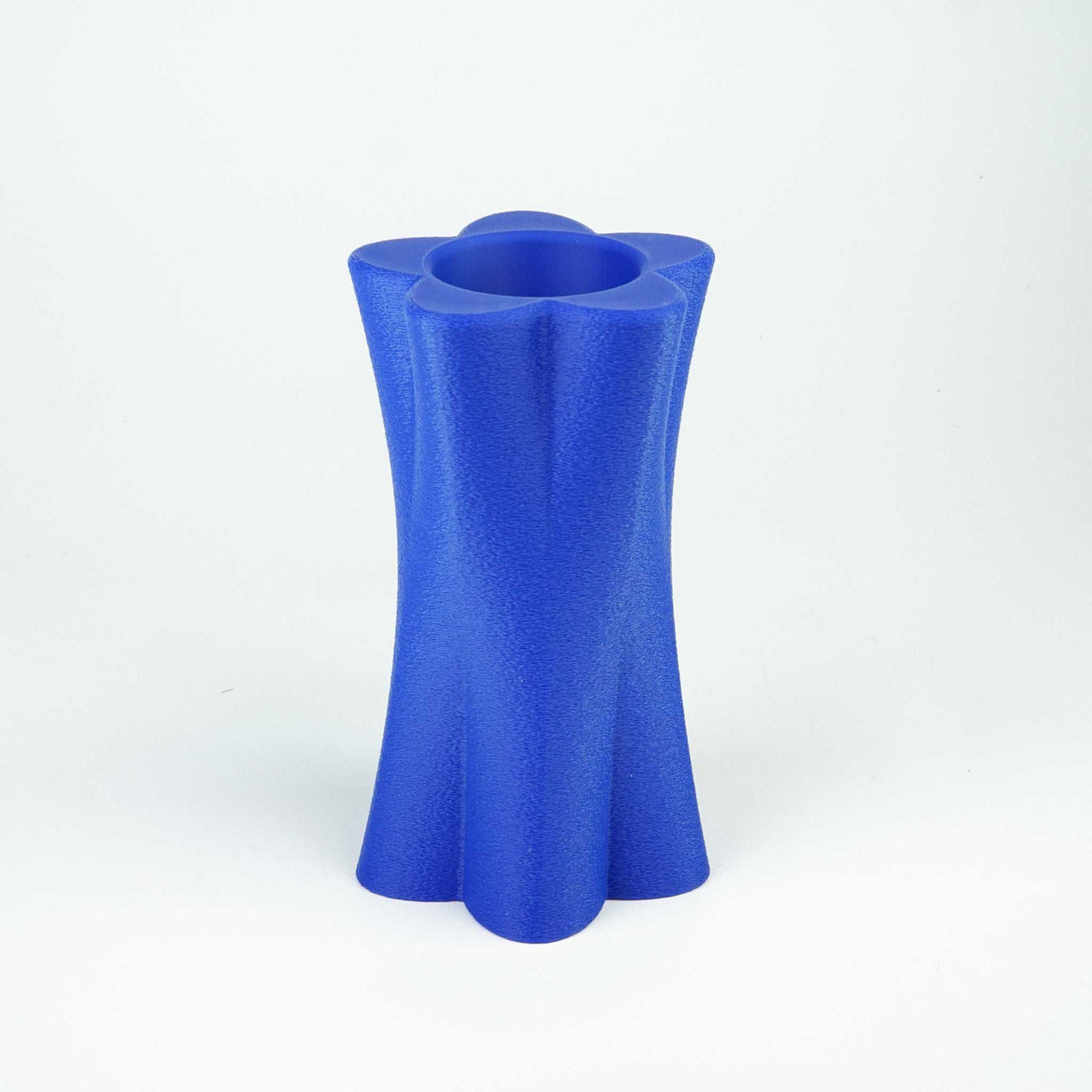 3D Flower vase in blue, recyclable PLA, with glass insert for flowers.